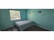 Bright bedroom with charming elephant wall decals, window view, and wood-look floors at 8612 Valley Ridge Ct, Orlando, FL 32818