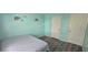 Bright bedroom with decorative elephant wall decals, two doors, and modern wood-look floors at 8612 Valley Ridge Ct, Orlando, FL 32818