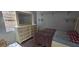 Bedroom with wood floors, a dresser, and a bed at 8612 Valley Ridge Ct, Orlando, FL 32818