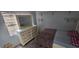 Bedroom with wood floors, a dresser, and a bed at 8612 Valley Ridge Ct, Orlando, FL 32818
