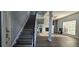Home entryway shows staircase, fireplace, and view to living space creating an inviting atmosphere at 8612 Valley Ridge Ct, Orlando, FL 32818