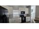 Bright kitchen featuring modern appliances, granite countertops, and ample cabinet space at 8612 Valley Ridge Ct, Orlando, FL 32818