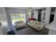 Spacious living room featuring hardwood floors, ceiling fan, and dining area at 8612 Valley Ridge Ct, Orlando, FL 32818