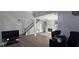 Spacious living room with an open floor plan, staircase, fireplace, hard wood floors, and a ceiling fan at 8612 Valley Ridge Ct, Orlando, FL 32818