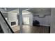 Open living room featuring wood floors, ceiling fan, neutral walls, and fireplace with a lot of natural light at 8612 Valley Ridge Ct, Orlando, FL 32818