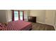 Bedroom featuring a large bed, wood floors, and large windows at 8612 Valley Ridge Ct, Orlando, FL 32818
