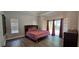 Spacious bedroom with natural light, tray ceiling, and access to the backyard at 8612 Valley Ridge Ct, Orlando, FL 32818