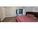 Bedroom with a large bed, wood floors, and attached bathroom at 8612 Valley Ridge Ct, Orlando, FL 32818