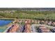 Aerial view highlights community amenities, lush greenery, tranquil lakes, and proximity to nature at 8919 Bismarck Palm Rd, Kissimmee, FL 34747