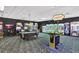 Arcade room with modern games and a pool table offers entertainment for everyone at 8919 Bismarck Palm Rd, Kissimmee, FL 34747