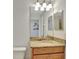 Bathroom featuring granite countertops and modern fixtures at 8919 Bismarck Palm Rd, Kissimmee, FL 34747