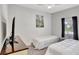 Bedroom featuring two beds, tv and ceiling fan at 8919 Bismarck Palm Rd, Kissimmee, FL 34747