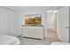 Bedroom with a dresser, flat screen TV and ensuite access at 8919 Bismarck Palm Rd, Kissimmee, FL 34747