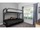 Comfortable bedroom with a bunk bed, natural light, and tasteful decor for a relaxing retreat at 8919 Bismarck Palm Rd, Kissimmee, FL 34747