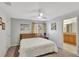 Bright bedroom with a modern wood-slat headboard and neutral decor at 8919 Bismarck Palm Rd, Kissimmee, FL 34747