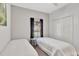 Bedroom featuring two beds, closet and window at 8919 Bismarck Palm Rd, Kissimmee, FL 34747
