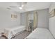 Bedroom with two twin beds, ceiling fan, and neutral-colored walls at 8919 Bismarck Palm Rd, Kissimmee, FL 34747