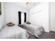 Cozy bedroom featuring two twin beds, ample natural light, and a closet for storage at 8919 Bismarck Palm Rd, Kissimmee, FL 34747