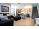 Inviting living room features tile flooring and an open floor plan that flows into the kitchen and dining area at 8919 Bismarck Palm Rd, Kissimmee, FL 34747