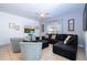 Cozy living room featuring blue accents and ample seating at 8919 Bismarck Palm Rd, Kissimmee, FL 34747