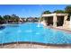 Community pool featuring a rock waterfall, and plenty of lounge space at 8919 Bismarck Palm Rd, Kissimmee, FL 34747