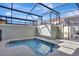 Enclosed pool area with a clear blue pool at 8919 Bismarck Palm Rd, Kissimmee, FL 34747