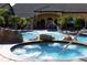 Enjoy the community pool with a hot tub, water fountains, and palm trees at 8919 Bismarck Palm Rd, Kissimmee, FL 34747