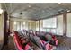 Enjoy movies in the community theater featuring tiered seating and a projection screen at 8919 Bismarck Palm Rd, Kissimmee, FL 34747