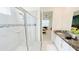 The bathroom offers a shower with glass doors and a seat, as well as a marble-topped vanity at 8940 Coconut Breeze Dr, Kissimmee, FL 34747