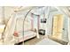 Cozy bedroom showcasing princess beds with sheer canopies and a decorative chandelier at 8940 Coconut Breeze Dr, Kissimmee, FL 34747