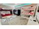Spacious ' bedroom featuring two sets of bunk beds, playful decor, and a lively atmosphere at 8940 Coconut Breeze Dr, Kissimmee, FL 34747