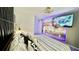 Charming bedroom with mounted TV and accent lighting creating a playful ambiance at 8940 Coconut Breeze Dr, Kissimmee, FL 34747