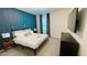 Inviting bedroom featuring a comfortable bed, contemporary furnishings, and lots of natural light at 8940 Coconut Breeze Dr, Kissimmee, FL 34747