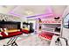 Spacious ' bedroom featuring bunk beds, playful decor, and neon colored ceiling lights at 8940 Coconut Breeze Dr, Kissimmee, FL 34747