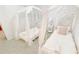 Charming bedroom featuring two princess beds, accented with soft pink decor and tulle canopies at 8940 Coconut Breeze Dr, Kissimmee, FL 34747