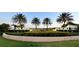 Solara Resort community entrance with manicured landscaping and prominent signage under a clear sky at 8940 Coconut Breeze Dr, Kissimmee, FL 34747