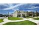 Two-story home with well-maintained lawn and inviting entryway, situated in a Gathering-friendly community at 8940 Coconut Breeze Dr, Kissimmee, FL 34747