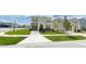Beautiful suburban home with a green lawn and a welcoming two-story facade in a Gathering-friendly neighborhood at 8940 Coconut Breeze Dr, Kissimmee, FL 34747
