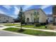 Charming two-story home with landscaped yard, offering a welcoming curb appeal in a residential neighborhood at 8940 Coconut Breeze Dr, Kissimmee, FL 34747