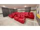 Dedicated home theater with luxurious seating, a large screen, and custom curtains for an immersive viewing experience at 8940 Coconut Breeze Dr, Kissimmee, FL 34747