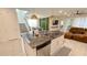 Modern kitchen island featuring granite countertops, stainless steel appliances, and pendant lighting at 8940 Coconut Breeze Dr, Kissimmee, FL 34747