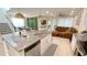 Modern kitchen island featuring granite countertops, stainless steel appliances, and pendant lighting at 8940 Coconut Breeze Dr, Kissimmee, FL 34747