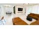 Open-concept living room with modern decor, dining area, and a seamless flow to the kitchen at 8940 Coconut Breeze Dr, Kissimmee, FL 34747