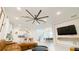 Expansive living space featuring a modern kitchen, dining area, and media center at 8940 Coconut Breeze Dr, Kissimmee, FL 34747