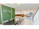 Open-concept living and dining area with sleek furniture, modern decor, and seamless flow to the kitchen at 8940 Coconut Breeze Dr, Kissimmee, FL 34747