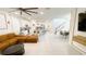 Bright, open living space with a modern kitchen, dining area, and staircase at 8940 Coconut Breeze Dr, Kissimmee, FL 34747