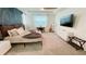 The main bedroom offers a stylish accent wall, a desk, a guitar, and a television for comfort and convenience at 8940 Coconut Breeze Dr, Kissimmee, FL 34747