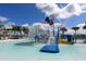 The community pool features water features, palm trees, plenty of lounge seating, and umbrellas for a resort style feel at 8940 Coconut Breeze Dr, Kissimmee, FL 34747