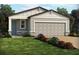 Charming single-story home with a two-car garage and beautifully landscaped front yard with vibrant flowers at 903 Donahue Pass, Lake Hamilton, FL 33851