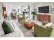 Open-concept living space with a view of the kitchen, featuring modern decor and comfortable seating at 903 Donahue Pass, Lake Hamilton, FL 33851